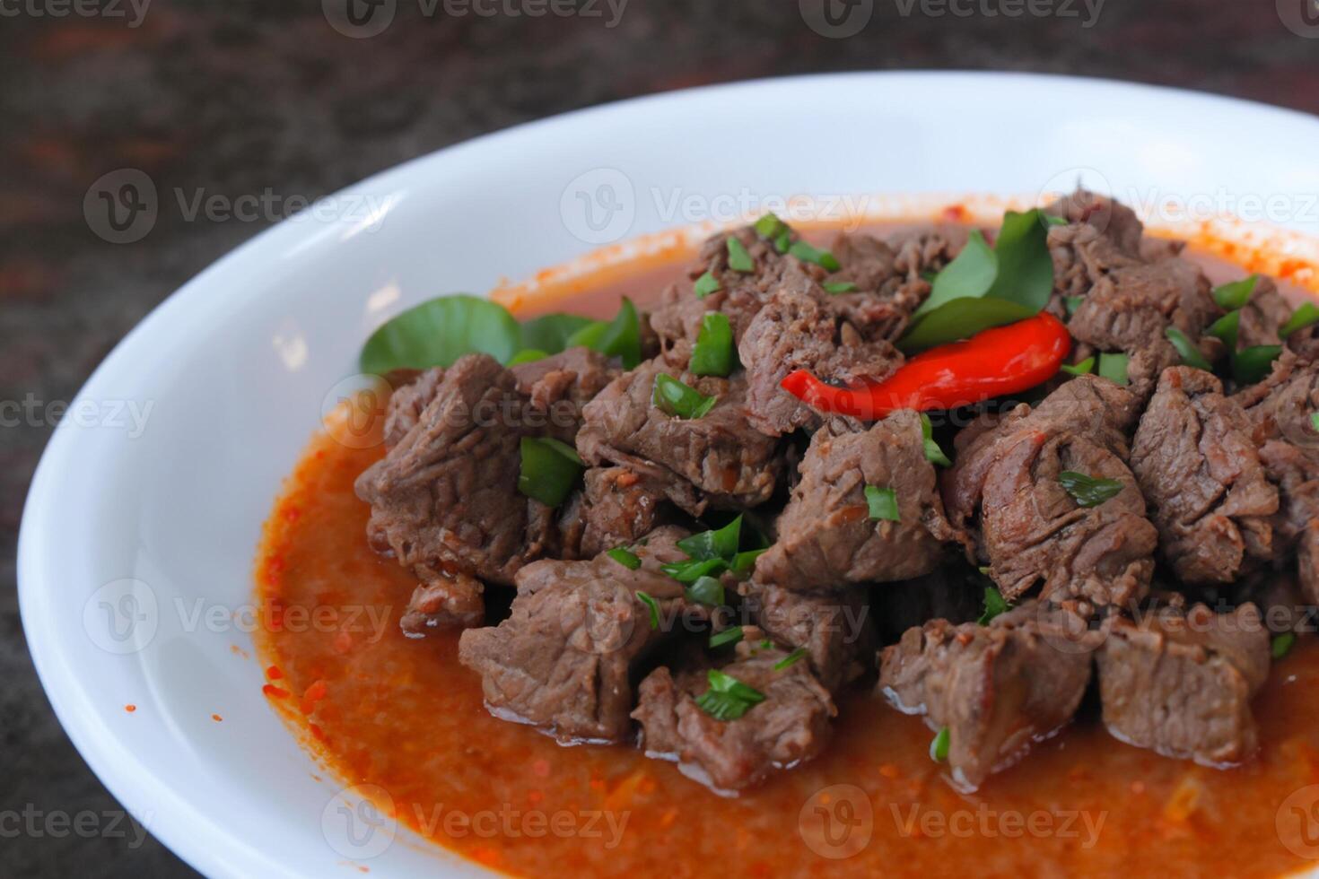 Savor the Exquisite Lamb or Beef Curry Rendang, Ready to Be Relished on Eid al-Adha, Capturing the Essence of Celebration in a Perfect Photo, Showcasing Culinary Mastery and Festive Indulgence photo