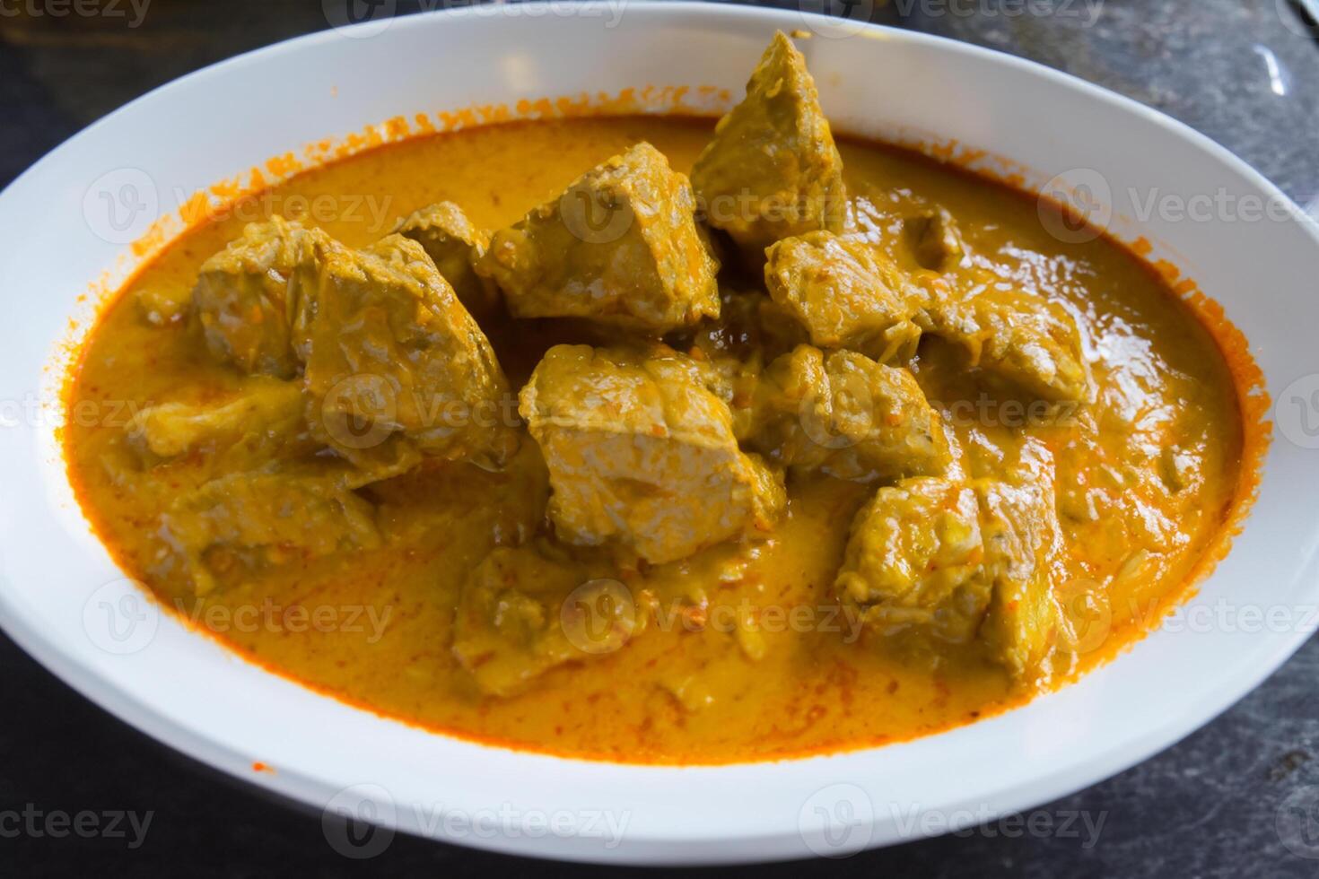 Savor the Exquisite Lamb or Beef Curry Rendang, Ready to Be Relished on Eid al-Adha, Capturing the Essence of Celebration in a Perfect Photo, Showcasing Culinary Mastery and Festive Indulgence photo