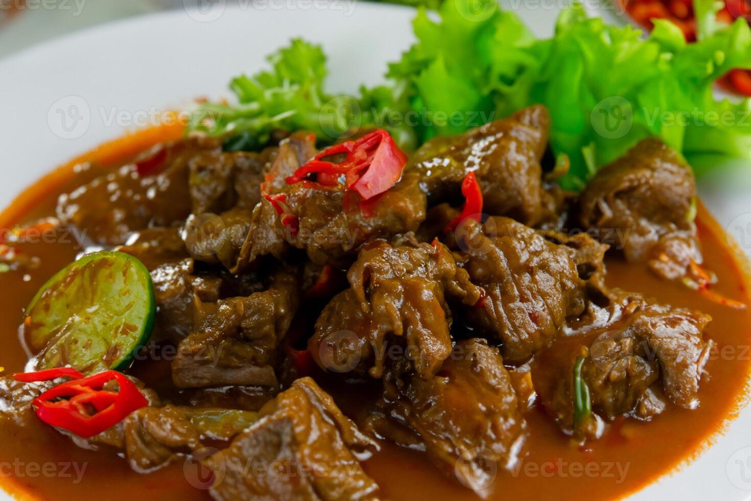 Savor the Exquisite Lamb or Beef Curry Rendang, Ready to Be Relished on Eid al-Adha, Capturing the Essence of Celebration in a Perfect Photo, Showcasing Culinary Mastery and Festive Indulgence photo