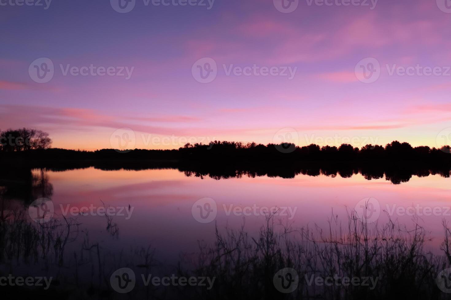 Serene Waters A Blissful Reflection of a Beautiful Pastel Lake and Sky, Where Tranquility Meets Nature's Palette, Creating a Harmonious Oasis of Soft Hues and Ethereal Beauty photo