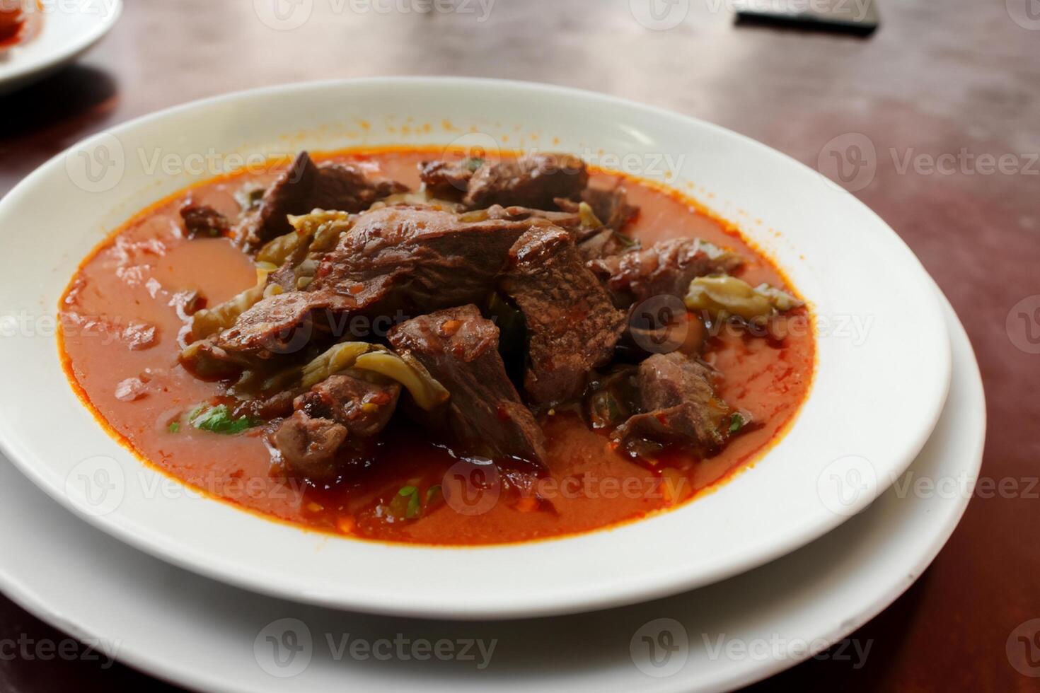 Savor the Exquisite Lamb or Beef Curry Rendang, Ready to Be Relished on Eid al-Adha, Capturing the Essence of Celebration in a Perfect Photo, Showcasing Culinary Mastery and Festive Indulgence photo