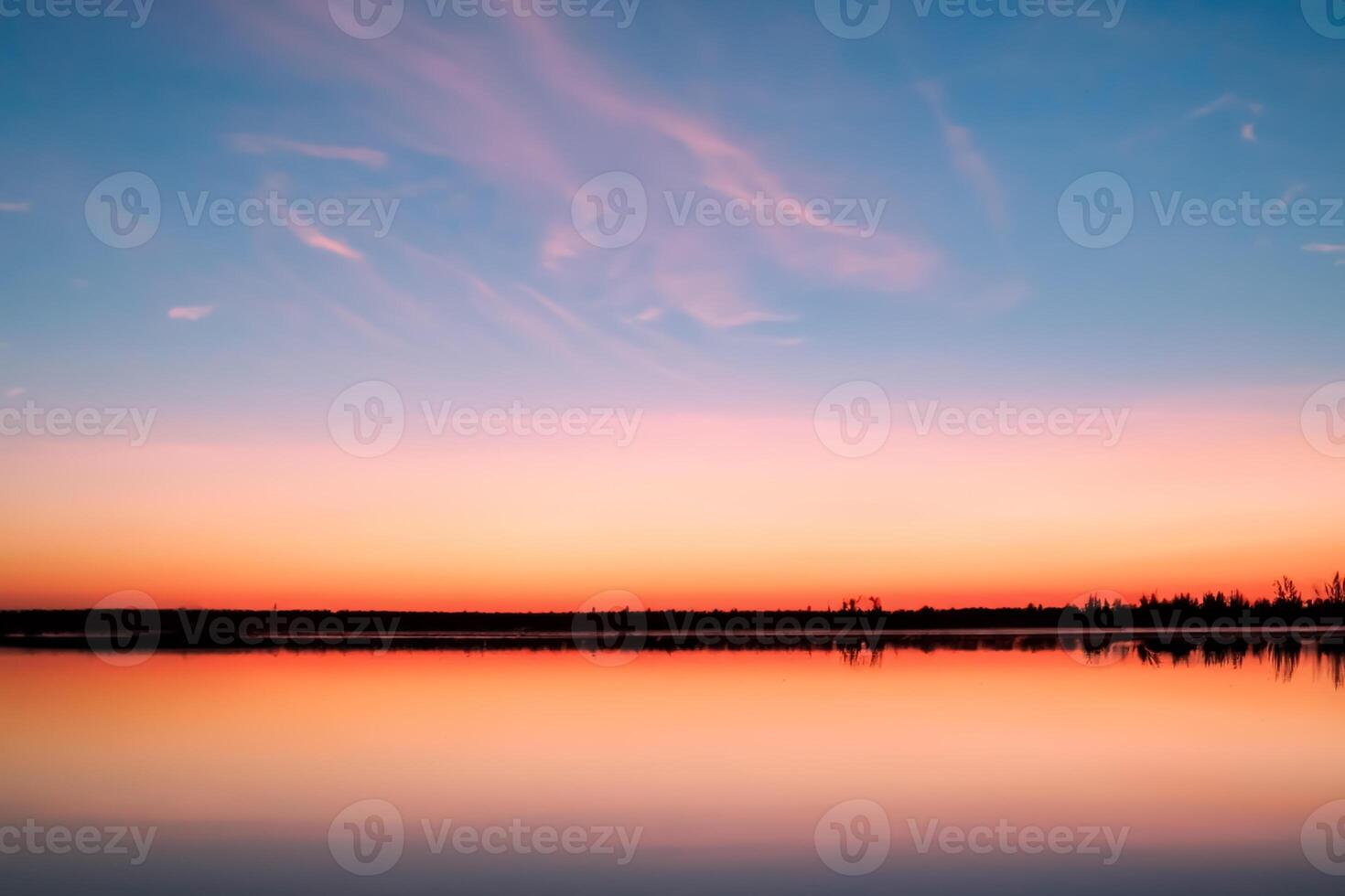Serene Waters A Blissful Reflection of a Beautiful Pastel Lake and Sky, Where Tranquility Meets Nature's Palette, Creating a Harmonious Oasis of Soft Hues and Ethereal Beauty photo