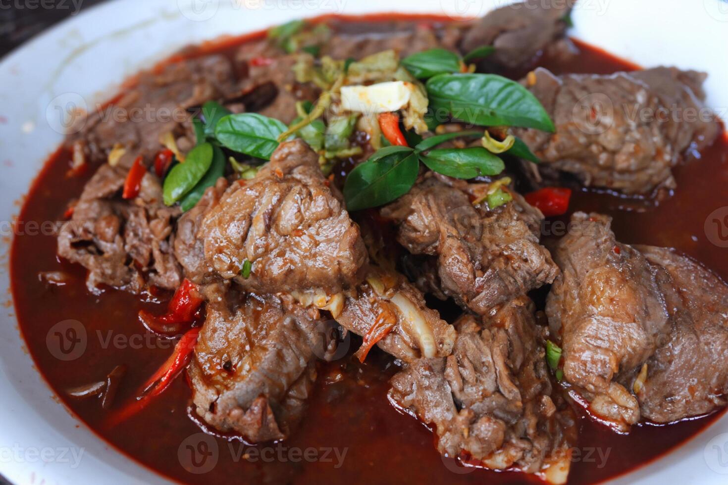 Savor the Exquisite Lamb or Beef Curry Rendang, Ready to Be Relished on Eid al-Adha, Capturing the Essence of Celebration in a Perfect Photo, Showcasing Culinary Mastery and Festive Indulgence photo