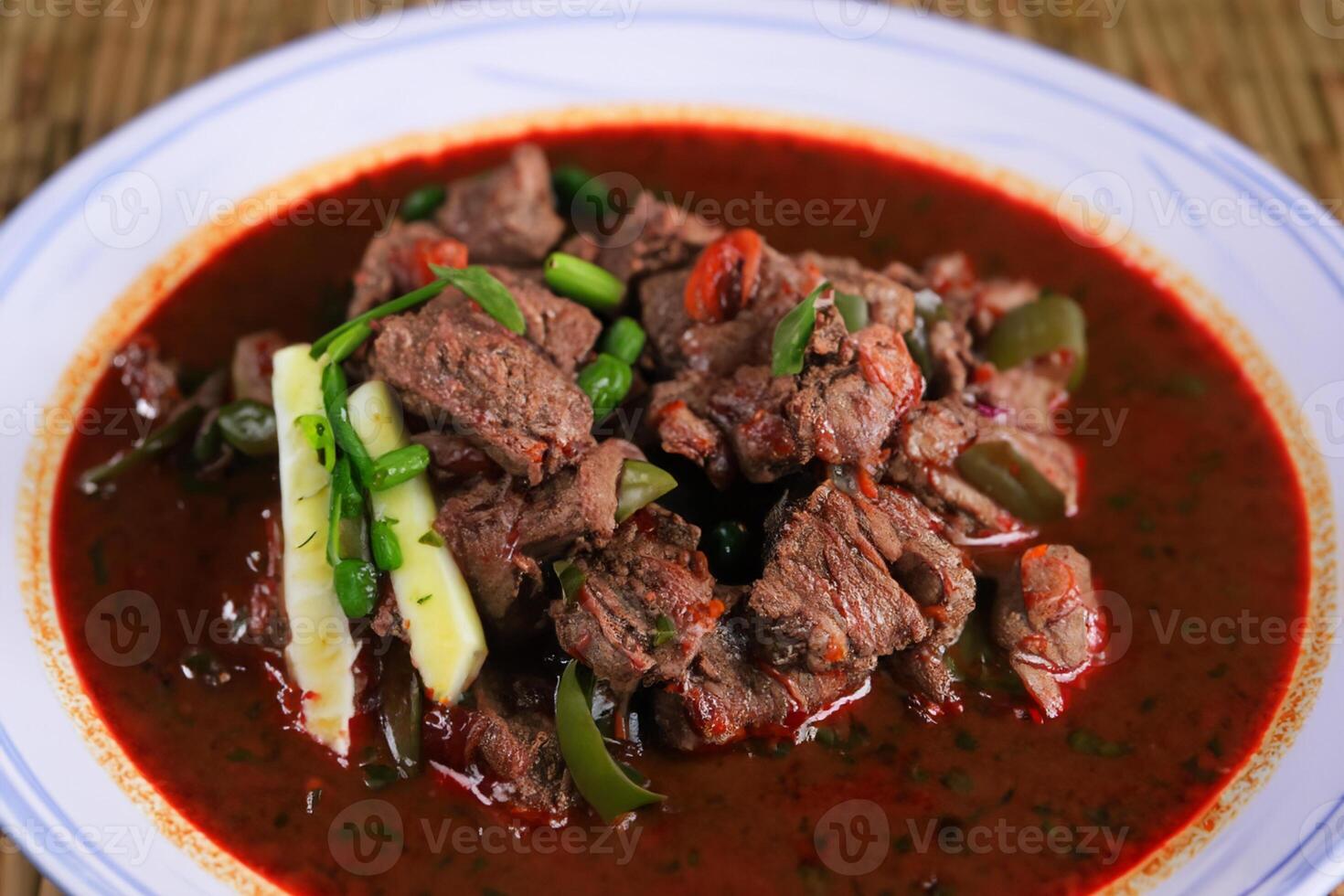 Savor the Exquisite Lamb or Beef Curry Rendang, Ready to Be Relished on Eid al-Adha, Capturing the Essence of Celebration in a Perfect Photo, Showcasing Culinary Mastery and Festive Indulgence photo