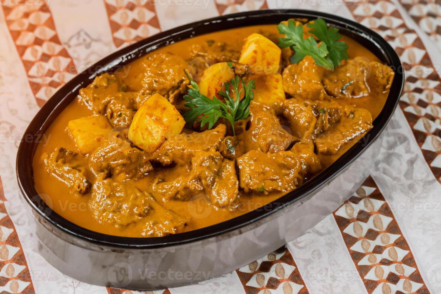 Savor the Exquisite Lamb or Beef Curry Rendang, Ready to Be Relished on Eid al-Adha, Capturing the Essence of Celebration in a Perfect Photo, Showcasing Culinary Mastery and Festive Indulgence photo