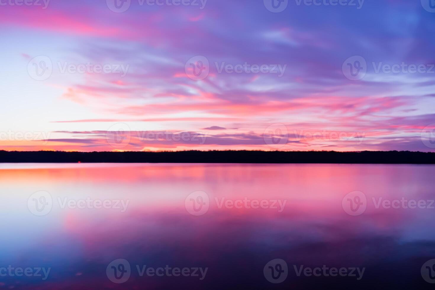 Serene Waters A Blissful Reflection of a Beautiful Pastel Lake and Sky, Where Tranquility Meets Nature's Palette, Creating a Harmonious Oasis of Soft Hues and Ethereal Beauty photo