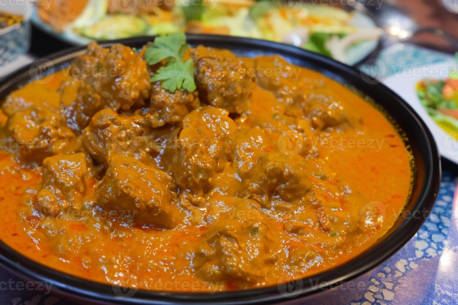 Savor the Exquisite Lamb or Beef Curry Rendang, Ready to Be Relished on Eid al-Adha, Capturing the Essence of Celebration in a Perfect Photo, Showcasing Culinary Mastery and Festive Indulgence photo