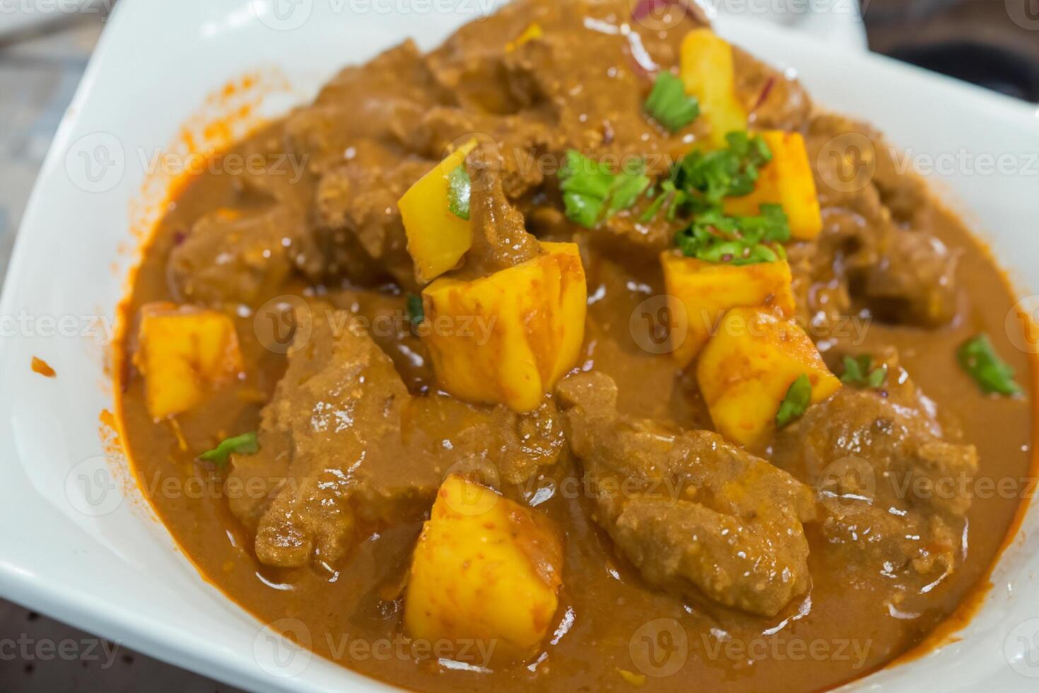 Savor the Exquisite Lamb or Beef Curry Rendang, Ready to Be Relished on Eid al-Adha, Capturing the Essence of Celebration in a Perfect Photo, Showcasing Culinary Mastery and Festive Indulgence photo