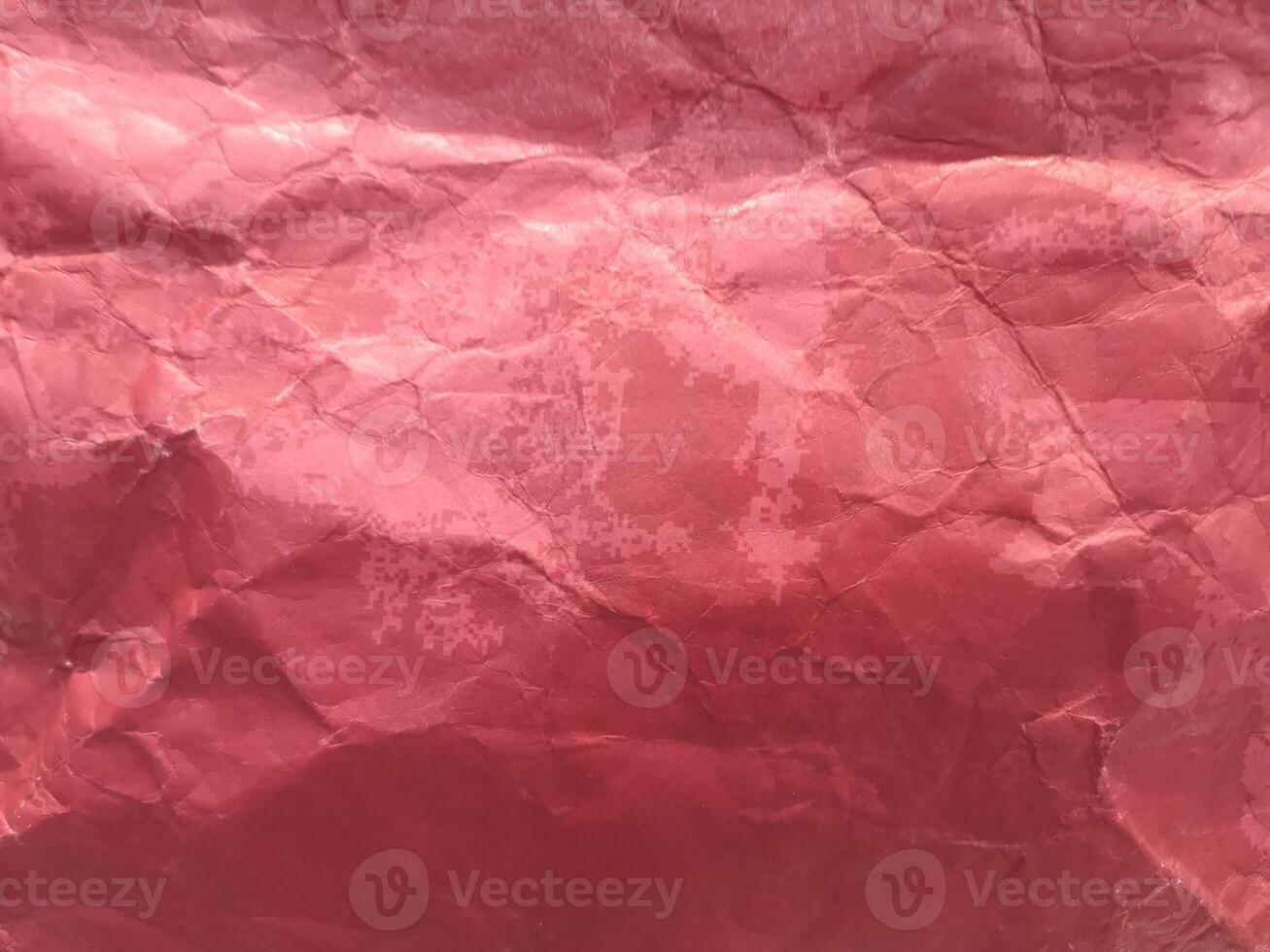 crumpled red paper paint or red paper background or texture photo