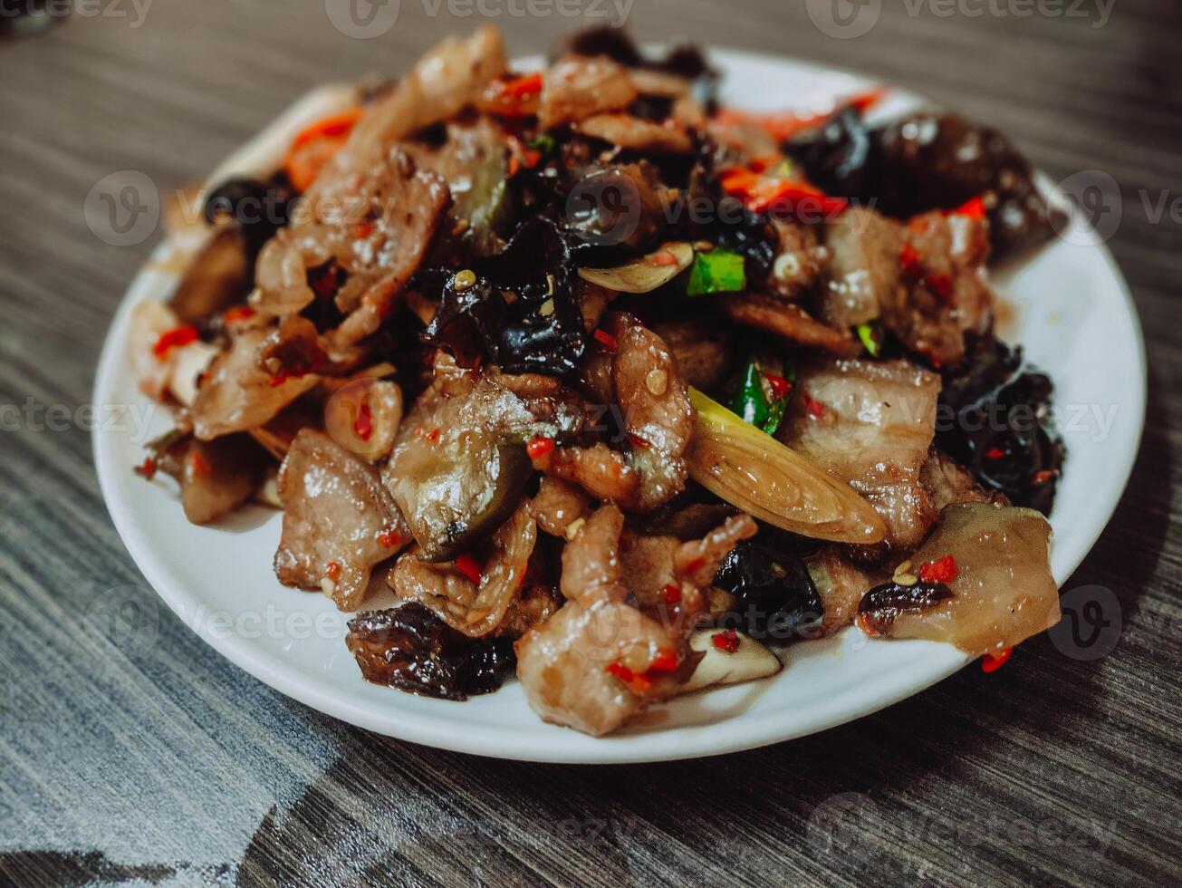 Wikoro, Pork Cuisine from Chinese Food Restaurant, not too spicy but delicious. Cooked with Black agaric, Auricularia auricula, as the third most important cultivated edible fungus in the world. photo