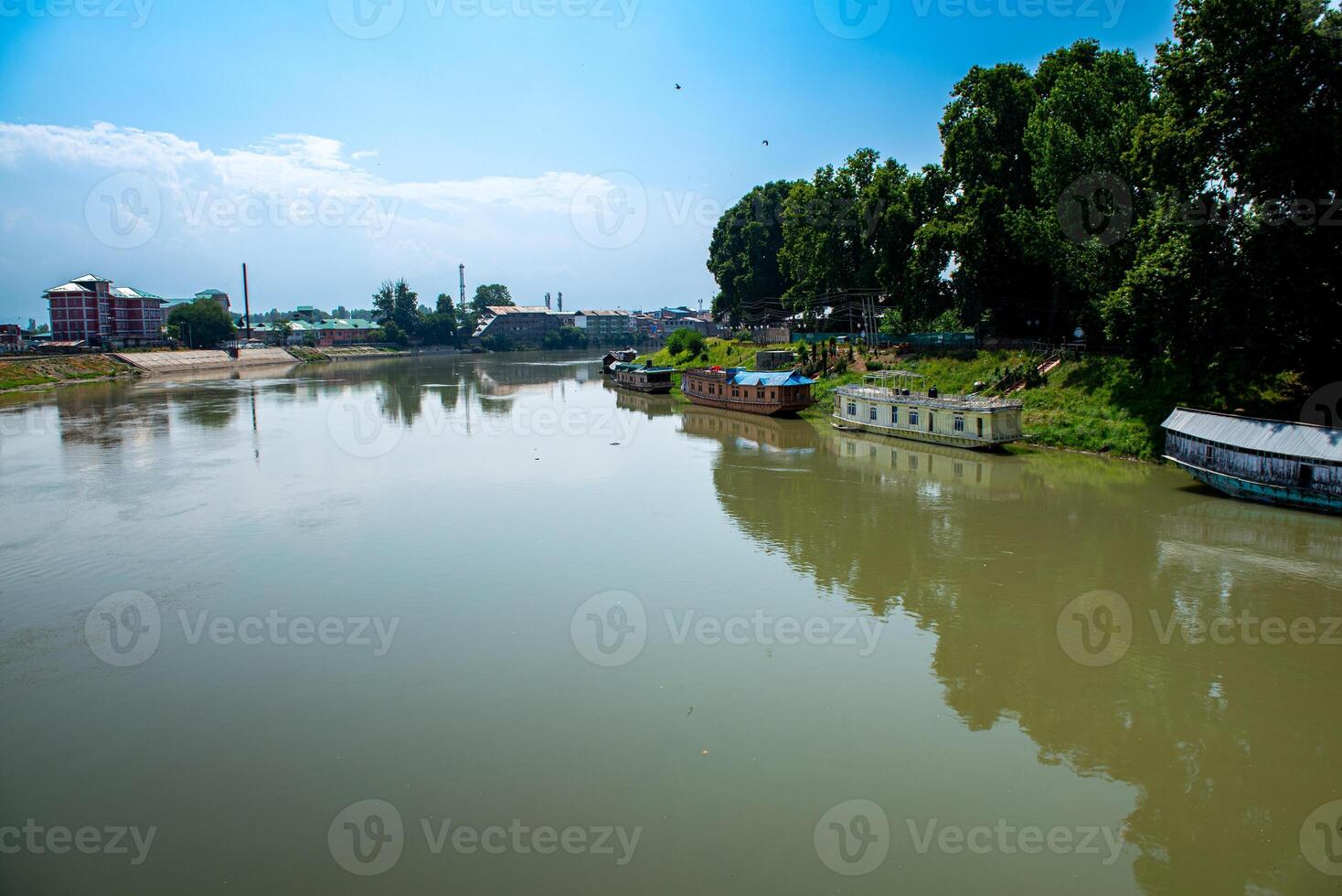 Dal Lake and the beautiful mountain range in the background in the summer Boat Trip of city Srinagar Kashmir India. photo