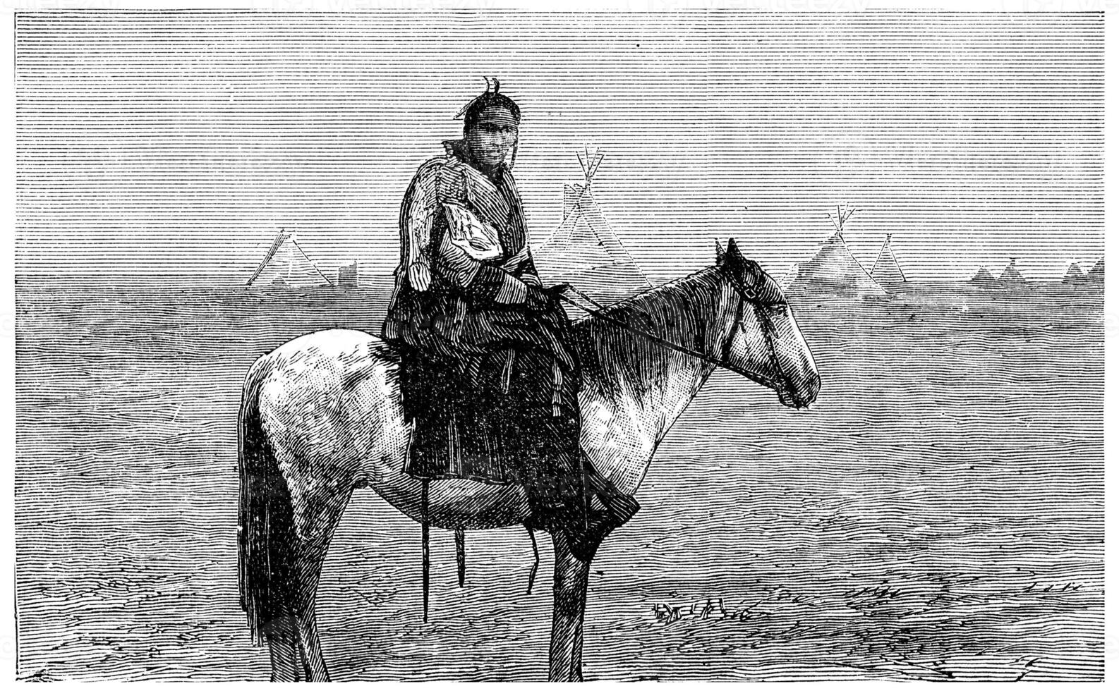 Chief Blackfoot watching a train go by, vintage engraving. photo