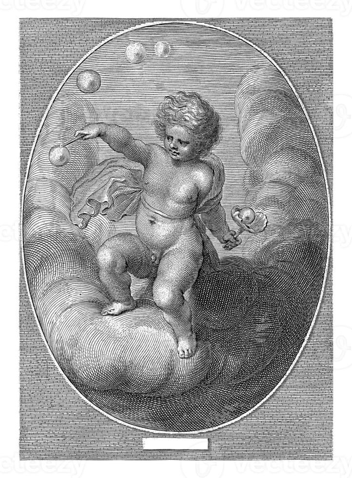 Element of air as a child blowing bubbles on a cloud. photo