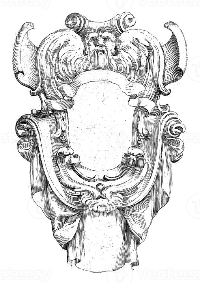 Cartouche with winged mask and draperies photo