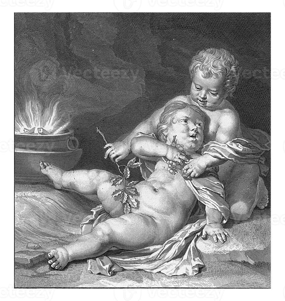 Two children with a bunch of grapes photo