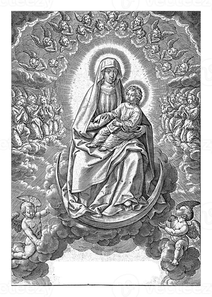 Mary sits with the Christ Child on her lap on the crescent moon. photo