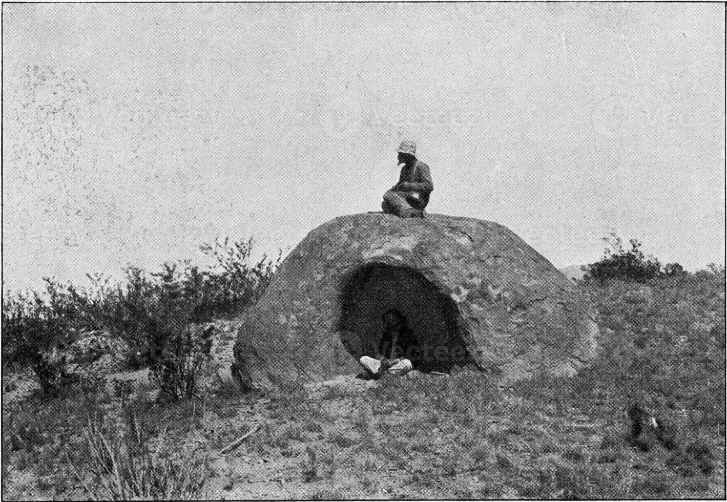 Block of granite hollowed out by the wind, vintage engraving. photo