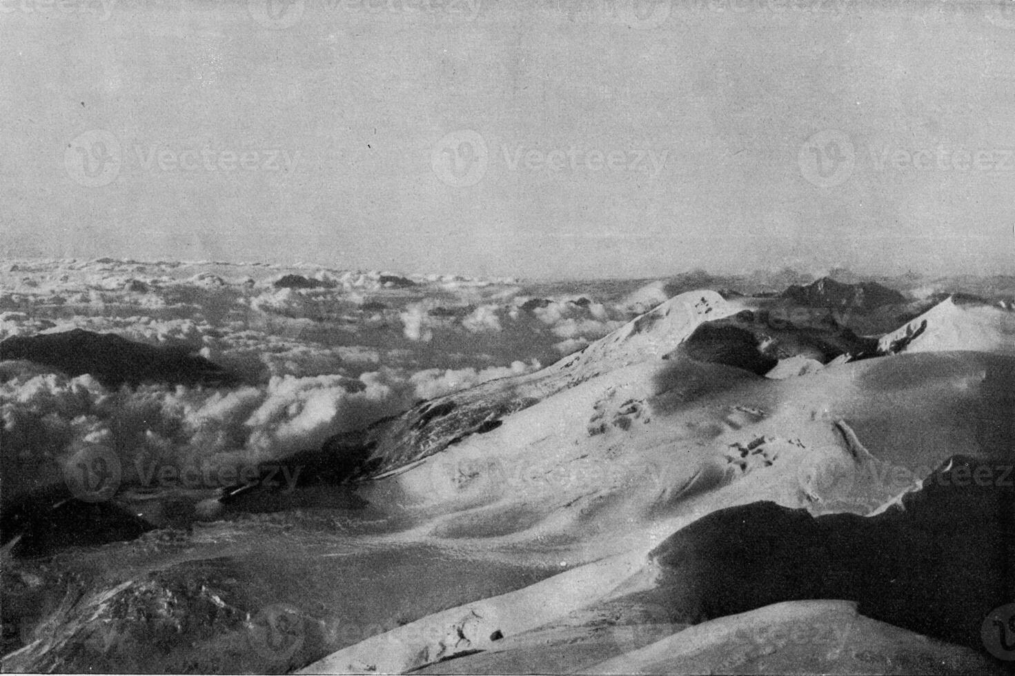 Sea of clouds between the peaks of high mountains, vintage engraving. photo