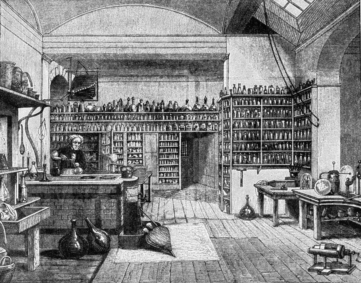 Faraday in his laboratory at the Royal Institution in London, vintage engraving. photo