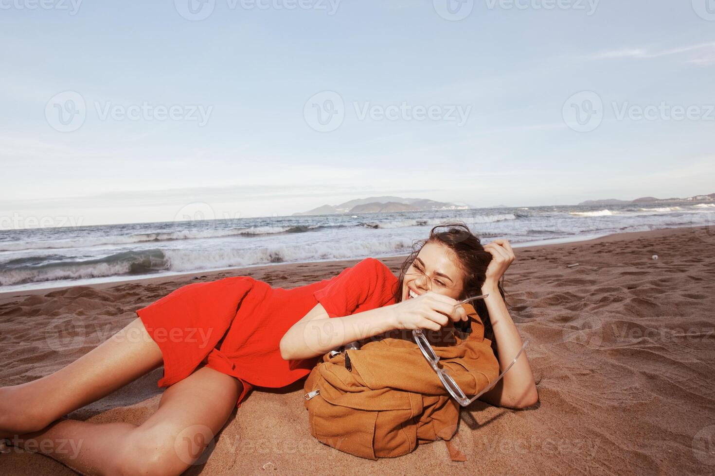 Joyful Backpacker. Drunk with Happiness on a Tropical Beach photo