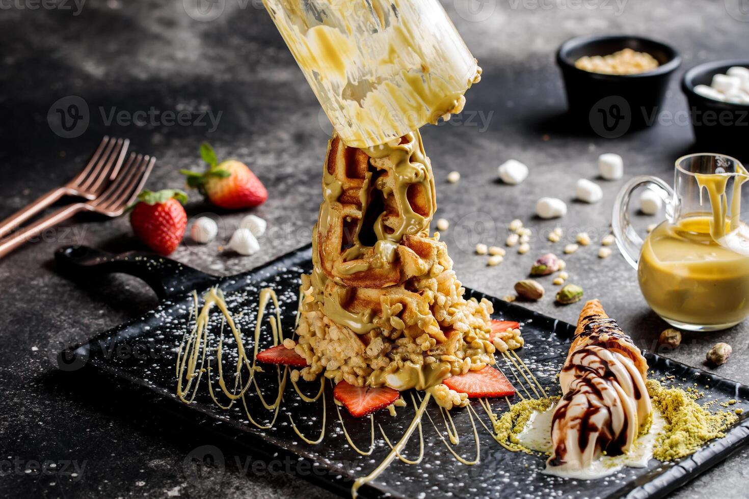 Chocolate and pistachio Waffle In a cup with strawberry served in dish isolated on table top view of cafe waffles food dessert photo