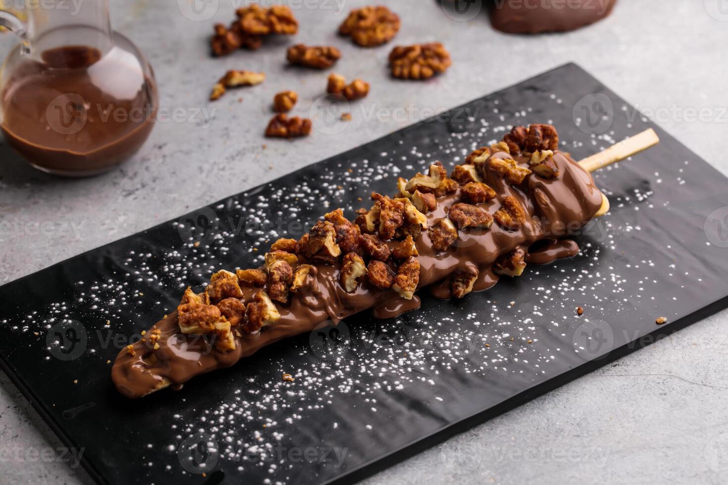 Crunchy Walnut Waffle In Stick dip with chocolate served in dish isolated on table top view of cafe waffles food dessert photo
