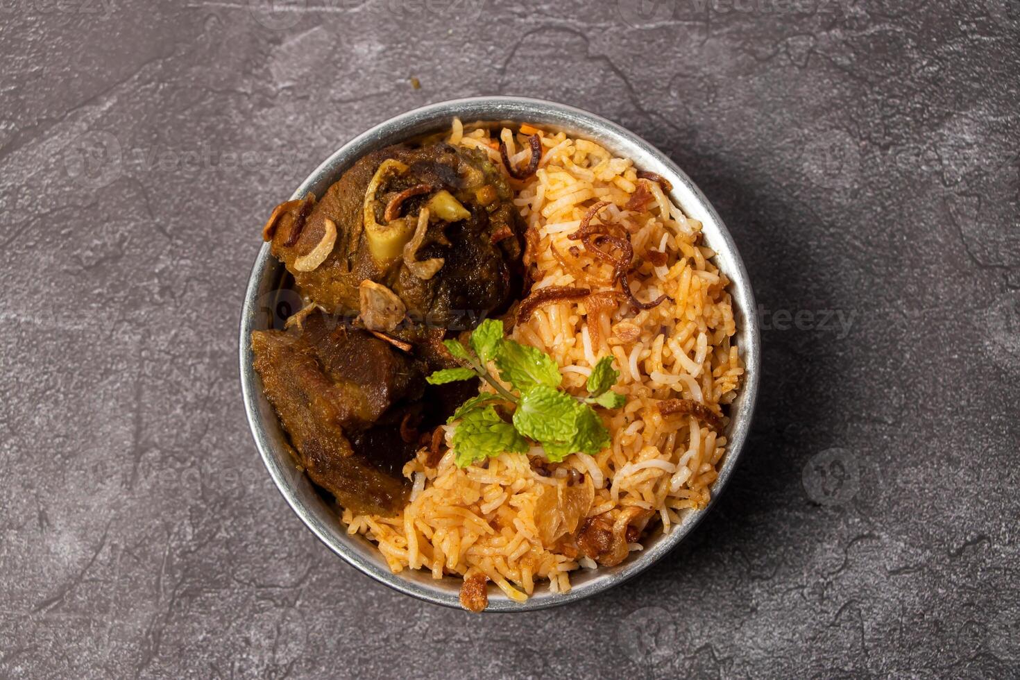 Hydrabadi Dum mutton Biriyani served in dish isolated on background top view of bangladesh food photo