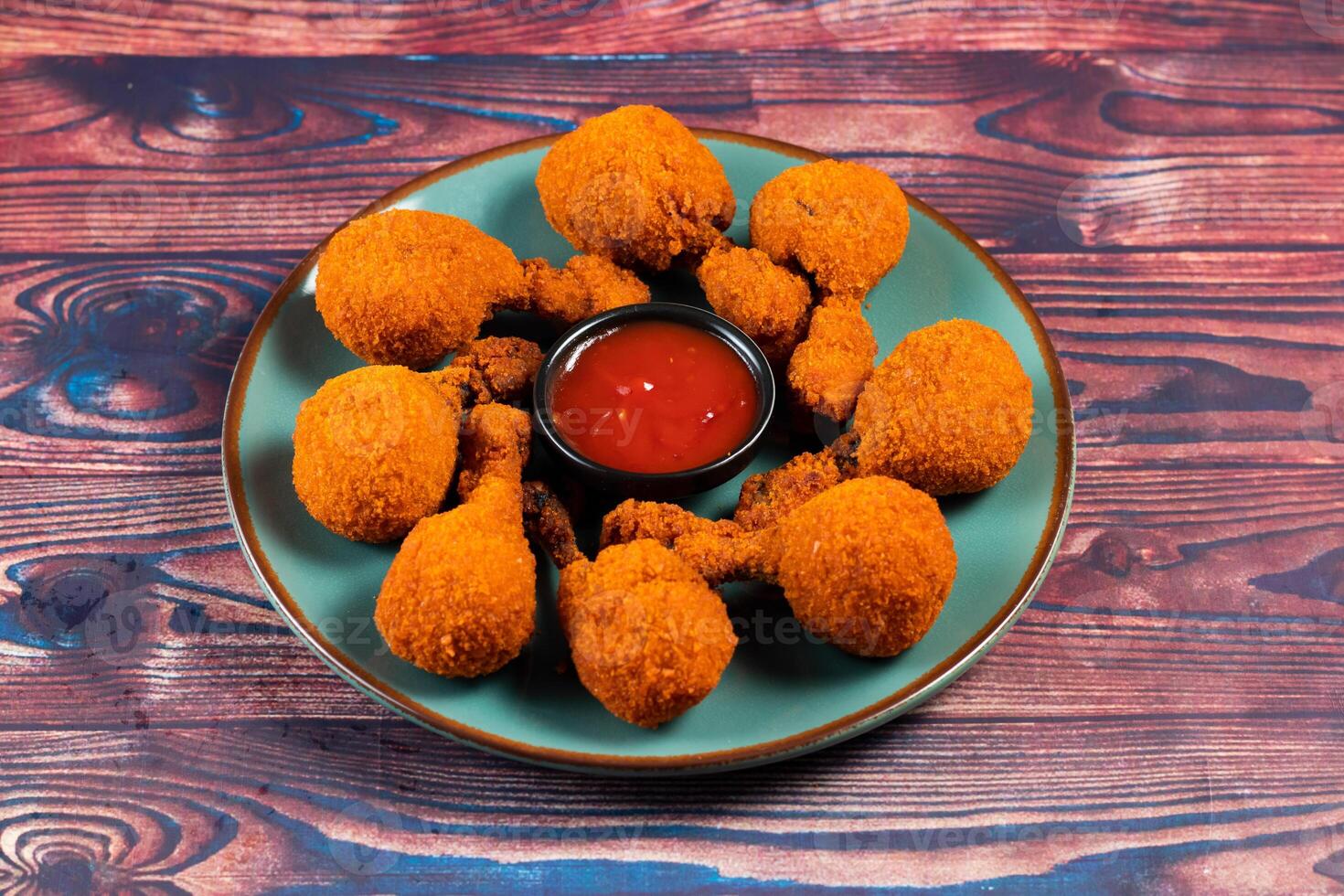 Deep fried Chicken Lolipop or Chicken drumstick with tomato sauce and mayo dip served in a dish isolated on background side view photo