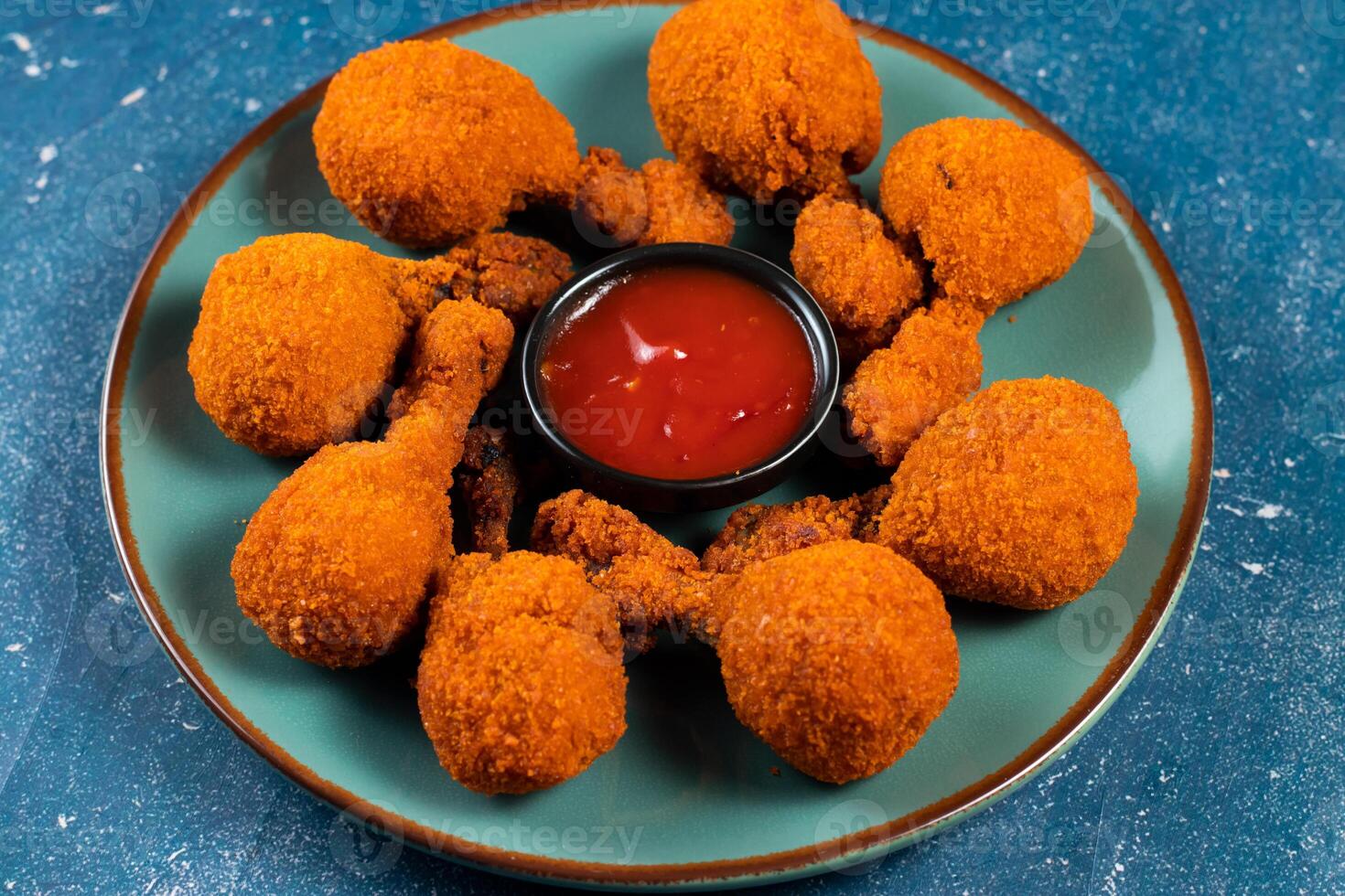 Deep fried Chicken Lolipop or Chicken drumstick with tomato sauce and mayo dip served in a dish isolated on background side view photo