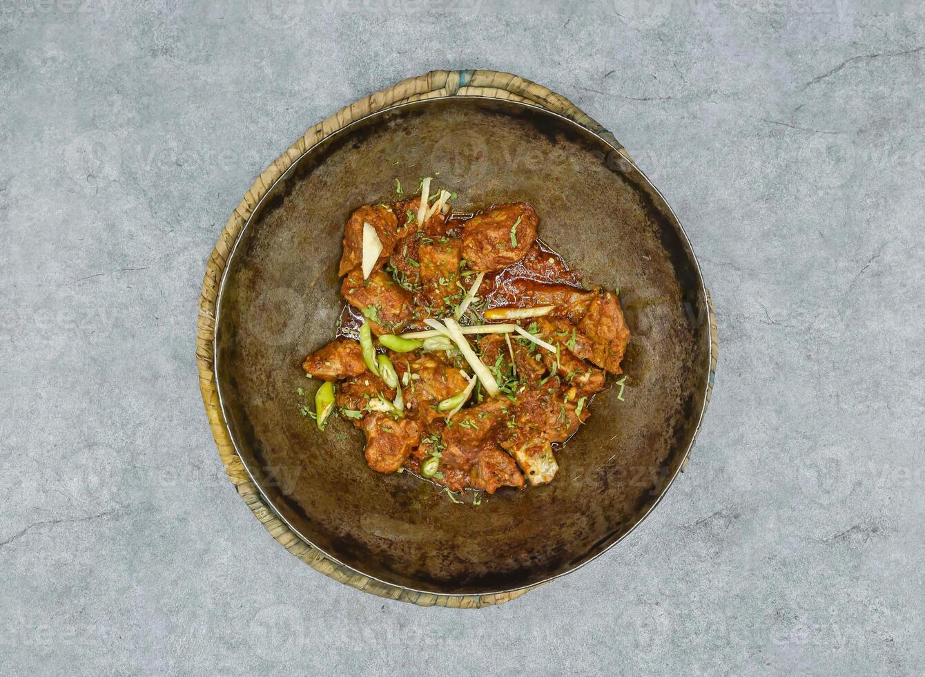 mutton karahi rogan josh korma masala served in dish isolated on background top view of indian spices and pakistani food photo