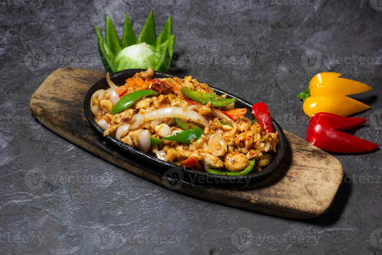 Chicken sizzling served in dish isolated on grey background top view of indian and bangladesh food photo
