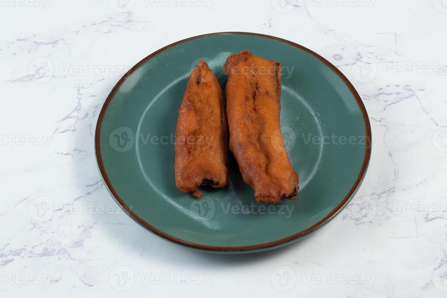 deep fried brinjal pakora or beguni served in a dish isolated on background top view of Indian and bengali food photo