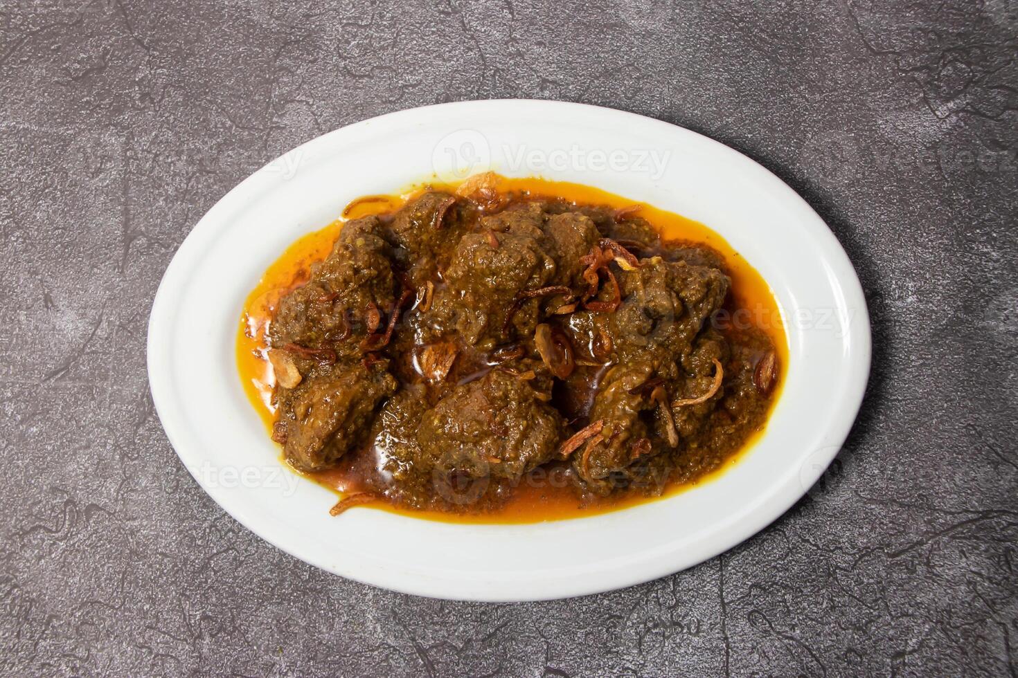 Beef Bhuna korma karahhi masala served in dish isolated on background top view of bangladesh food photo