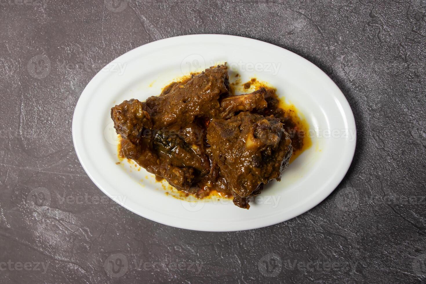 Mutton Bhuna karahi korma masala rogan josh vindloo served in dish isolated on background top view of bangladesh food photo