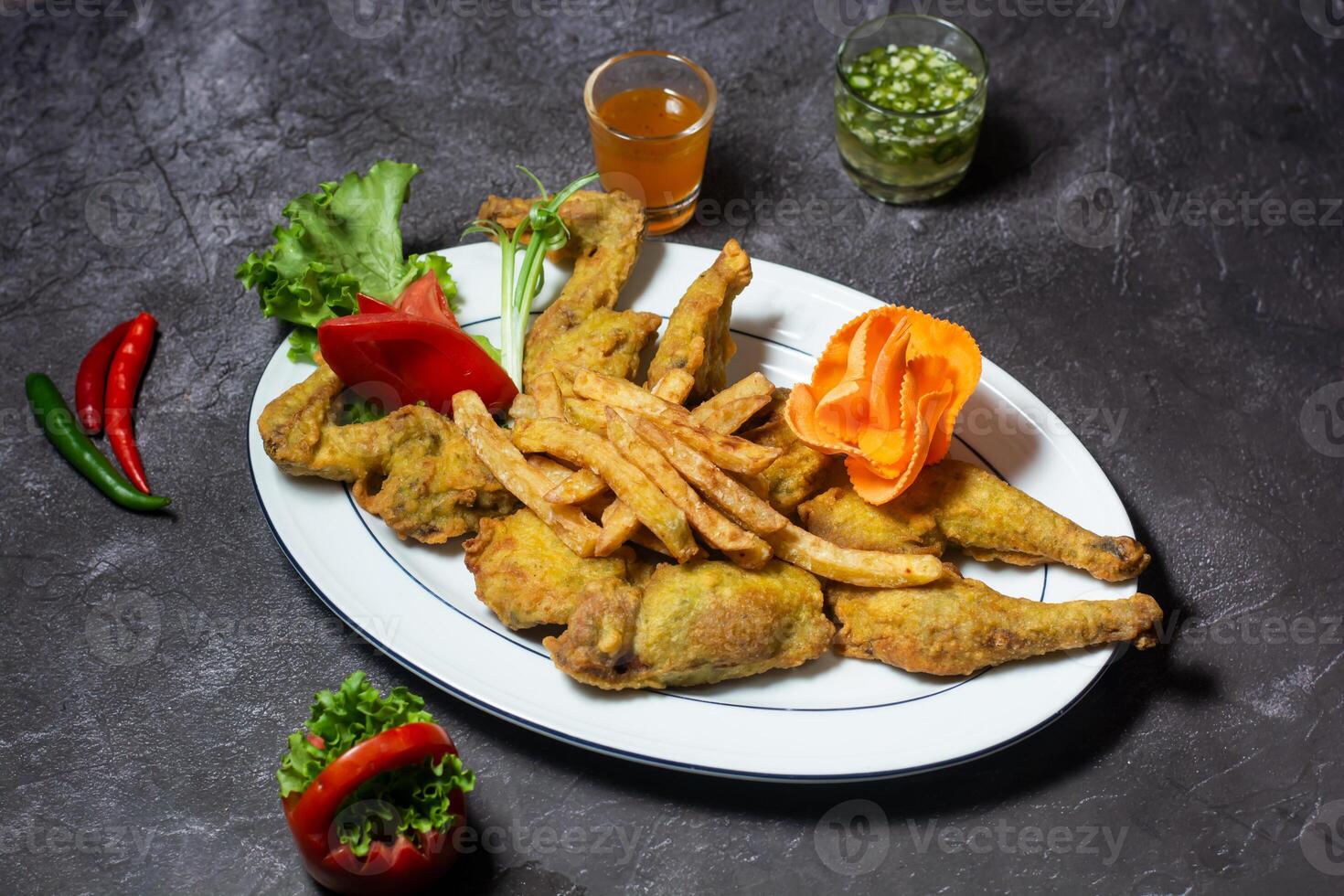 Crispy Fried Chicken with fries and sauce served in dish isolated on grey background top view of indian and bangladesh food photo