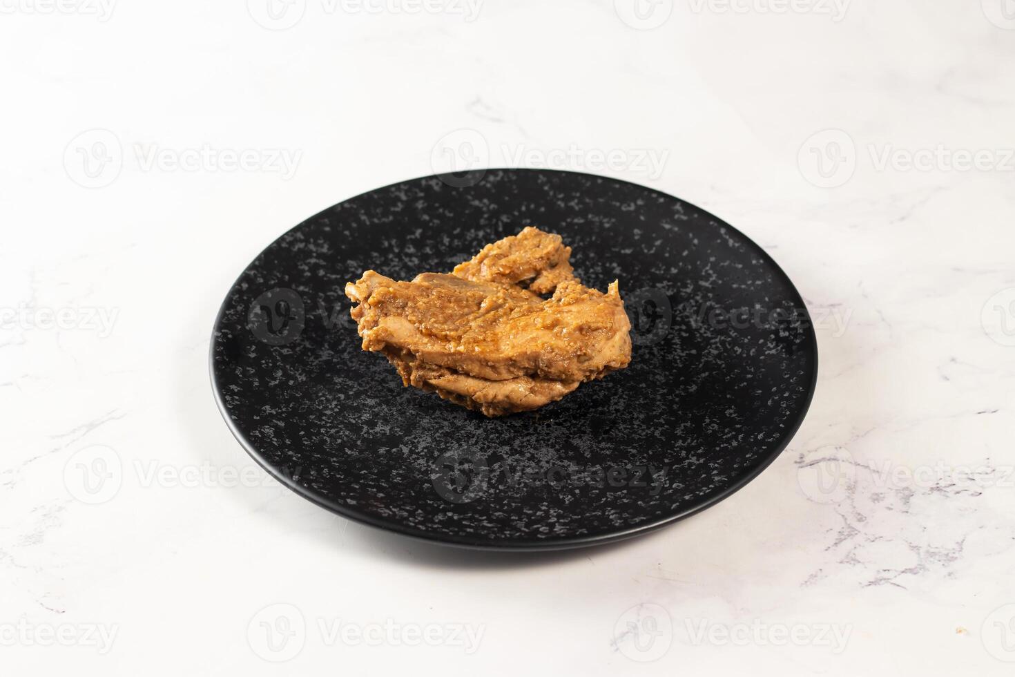 Crispy fried chicken piece in a plate isolated on marble background top view fast food photo