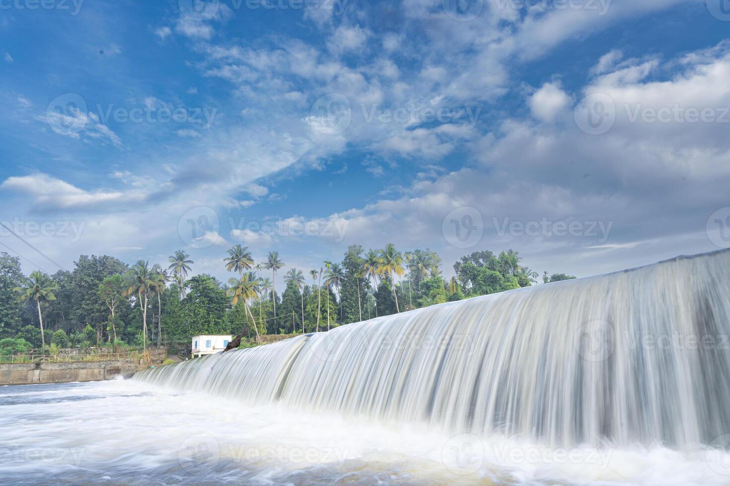 A beautiful view of a waterfall from a check dam In Kerala, India. photo