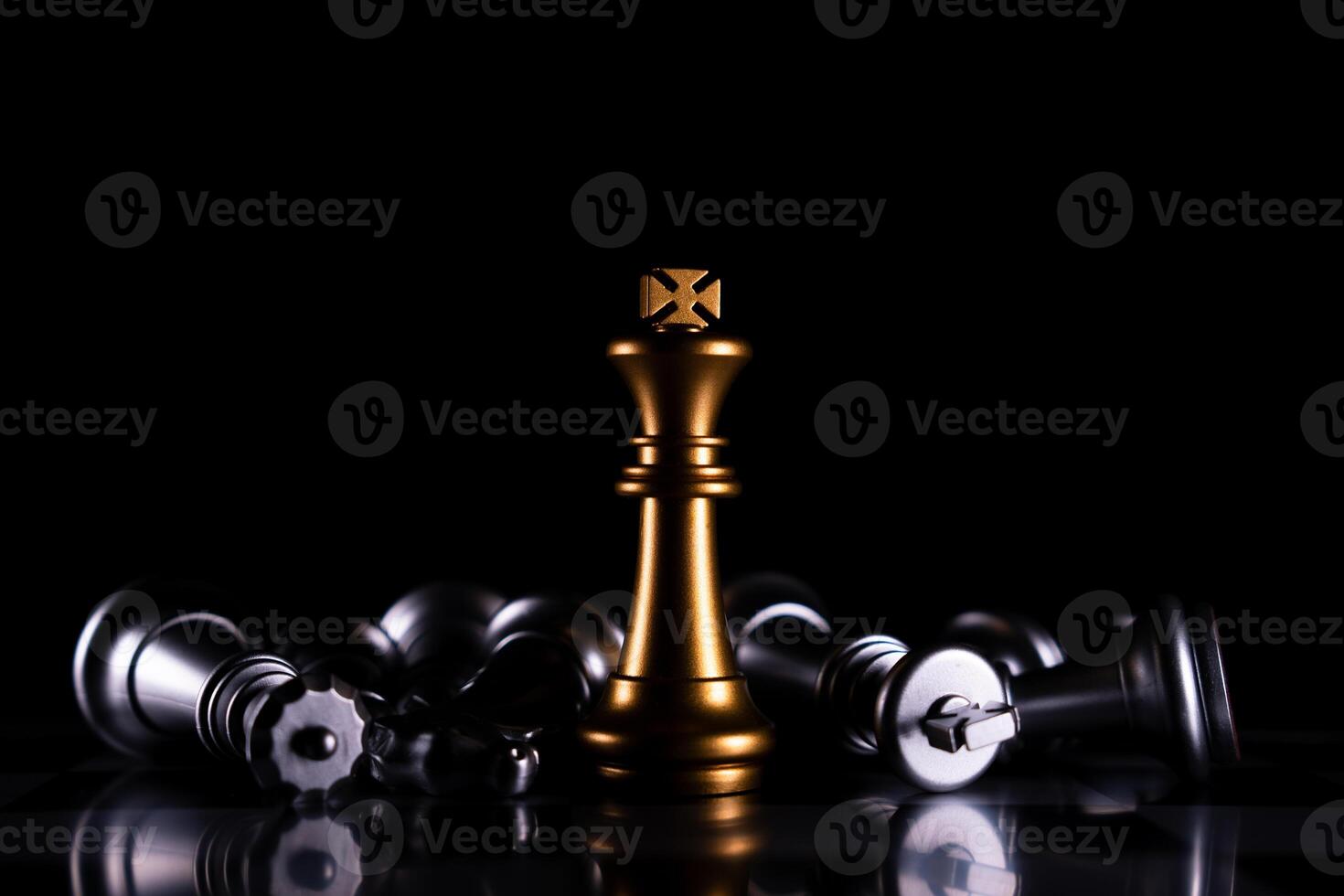 Golden King chess is last standing in the chess board, Concept of successful business leadership photo