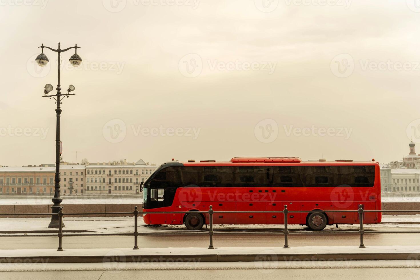 a tourist bus awaits tourists on the Neva River embankment photo