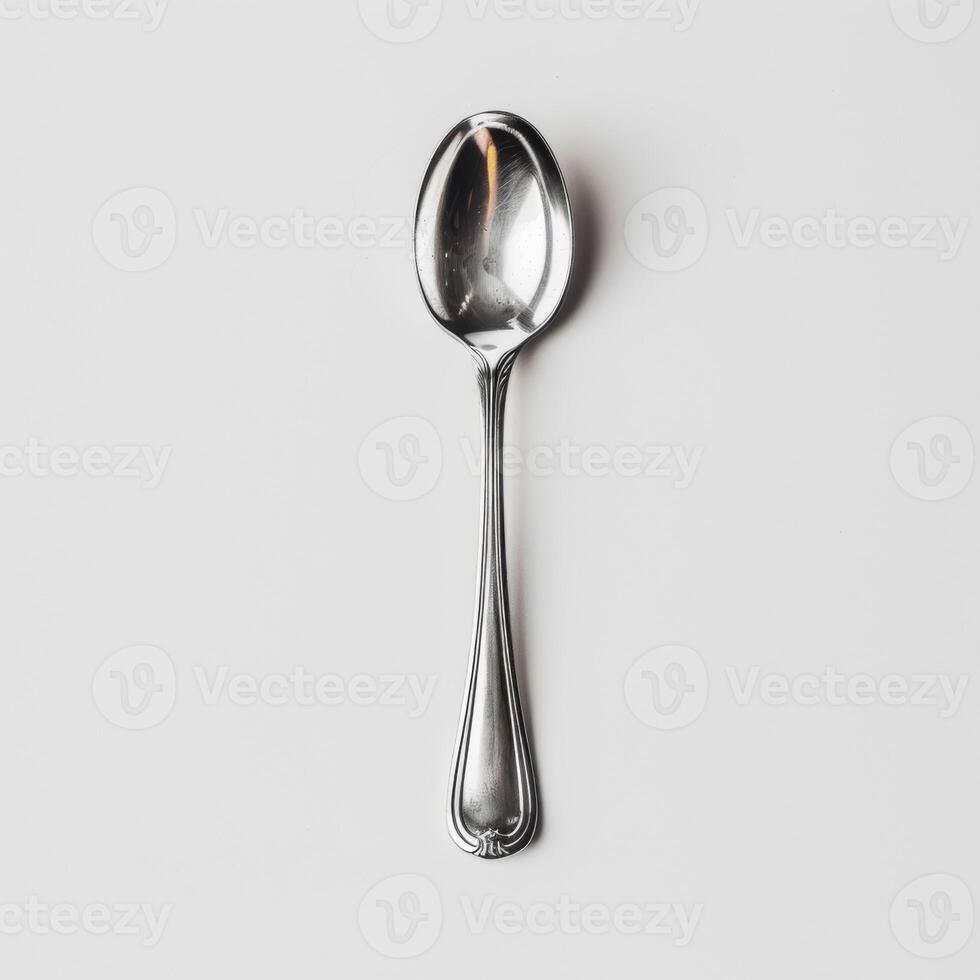 AI generated minimalistic style silver spoon on white background top view photo