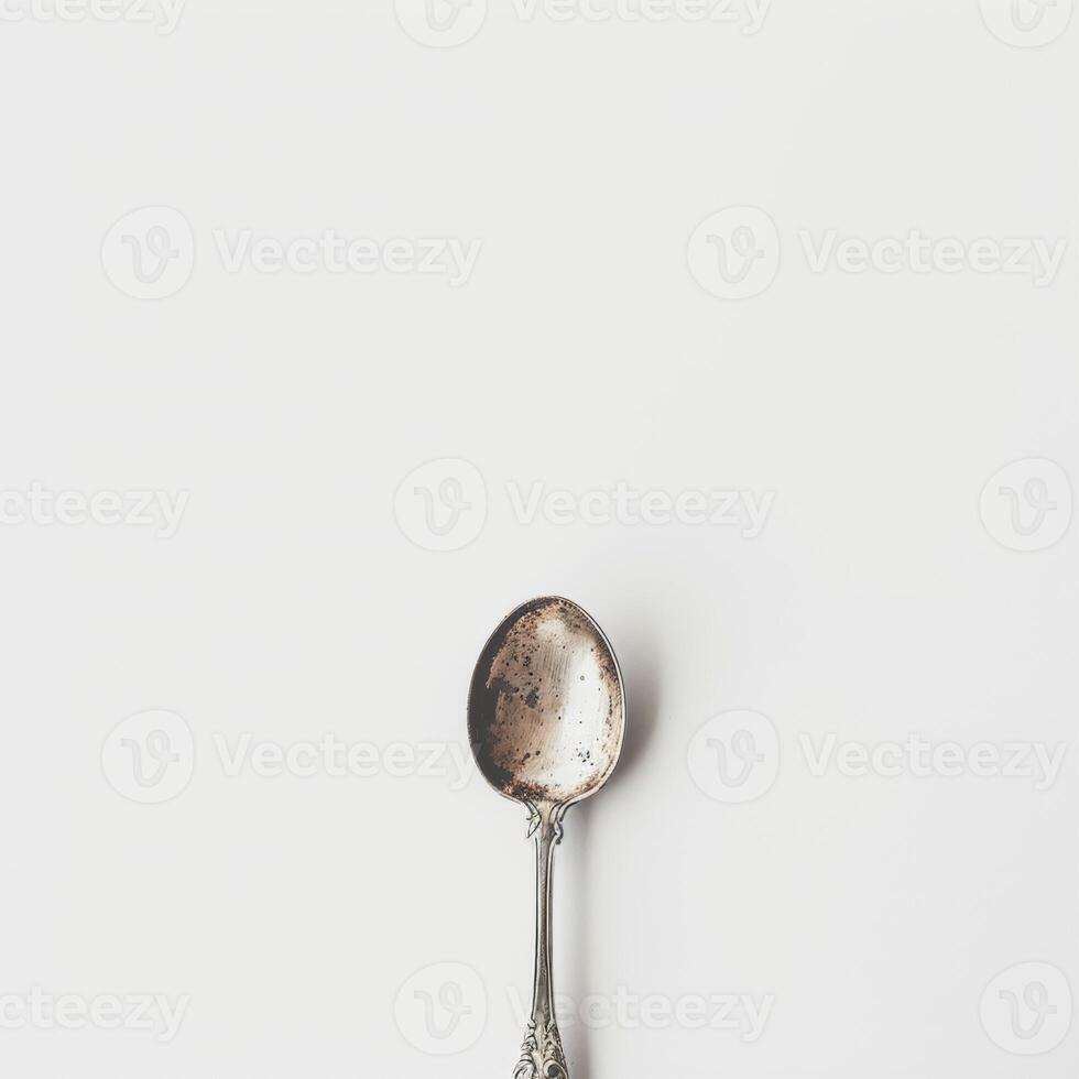 AI generated minimalistic style silver spoon on white background top view photo