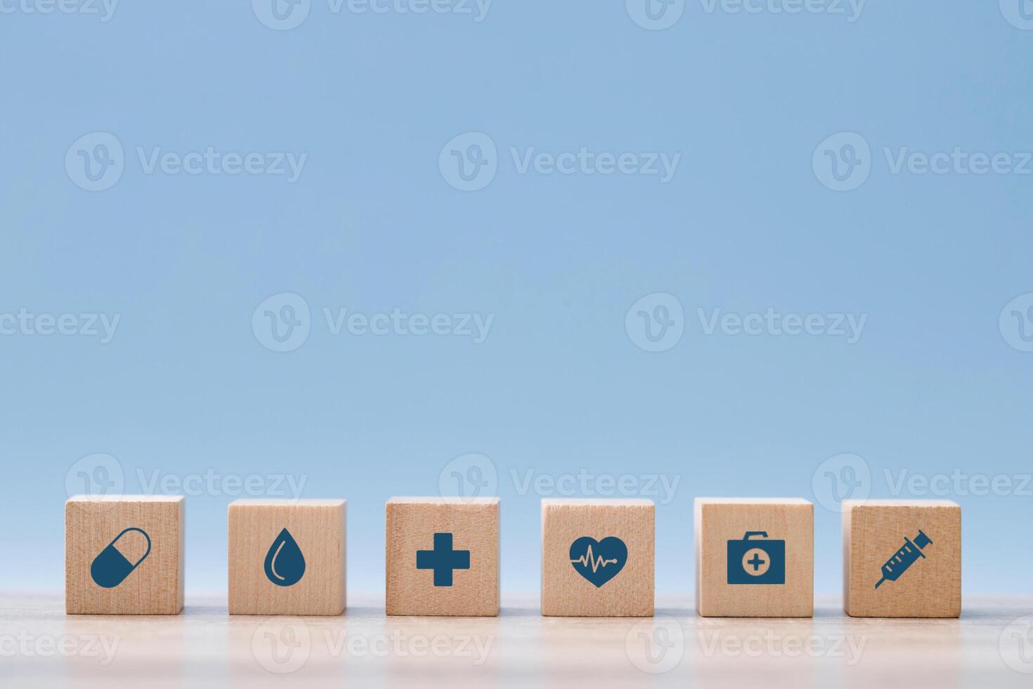 wood cube block stacking with healthcare medical icon equipment are readily available for viewing and treatment. Health insurance - concept. photo