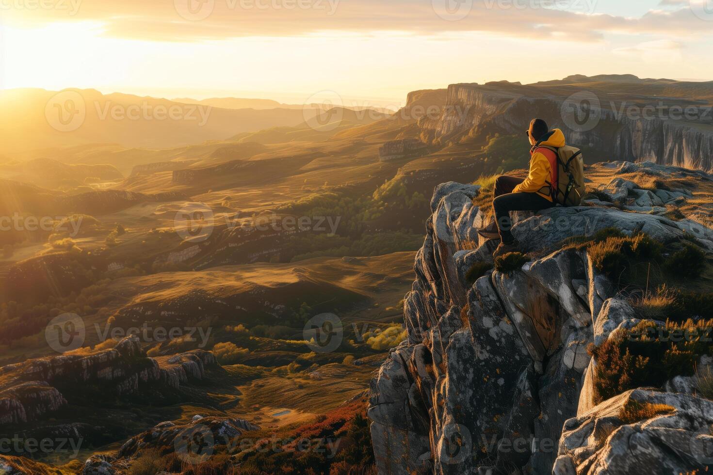 AI generated Hiker overlooking the sunset on a mountain cliff with copy space photo