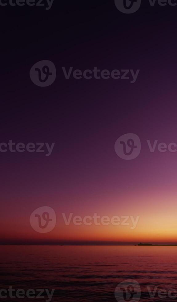Sunset Sky Background,Beautiful Nature Landscape Summer Sun dawn in Purple,Orange,Pink,Yellow,Twilight sky in the Evening by Sea beach,Romantic Sunrise Sky in Spring, Vertical Dusk sky with sea wave photo