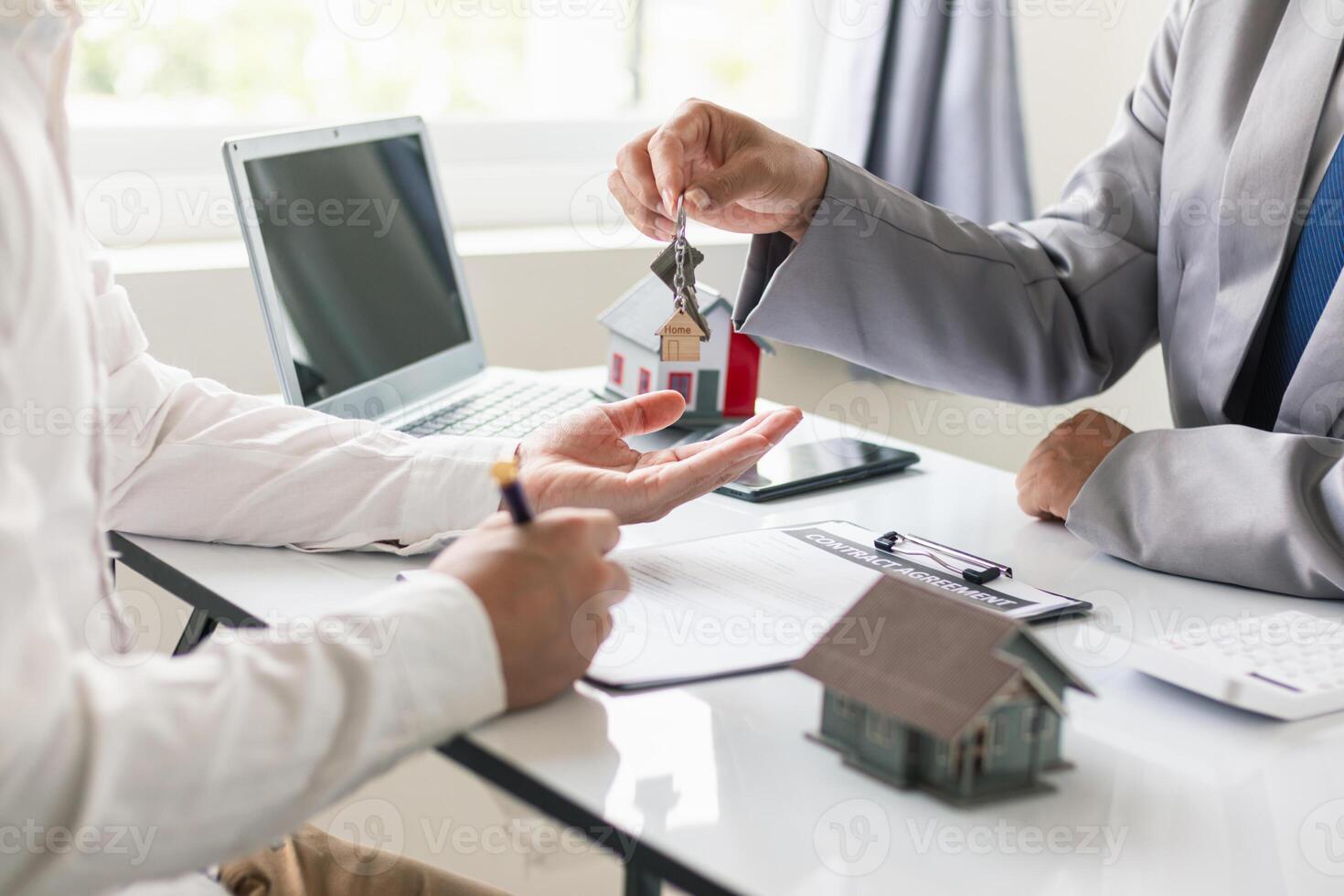 Real estate brokers are offering sample homes for customers choose from and recommending estate insurance promotions help protect their properties. Concept of offering real estate and home insurance photo