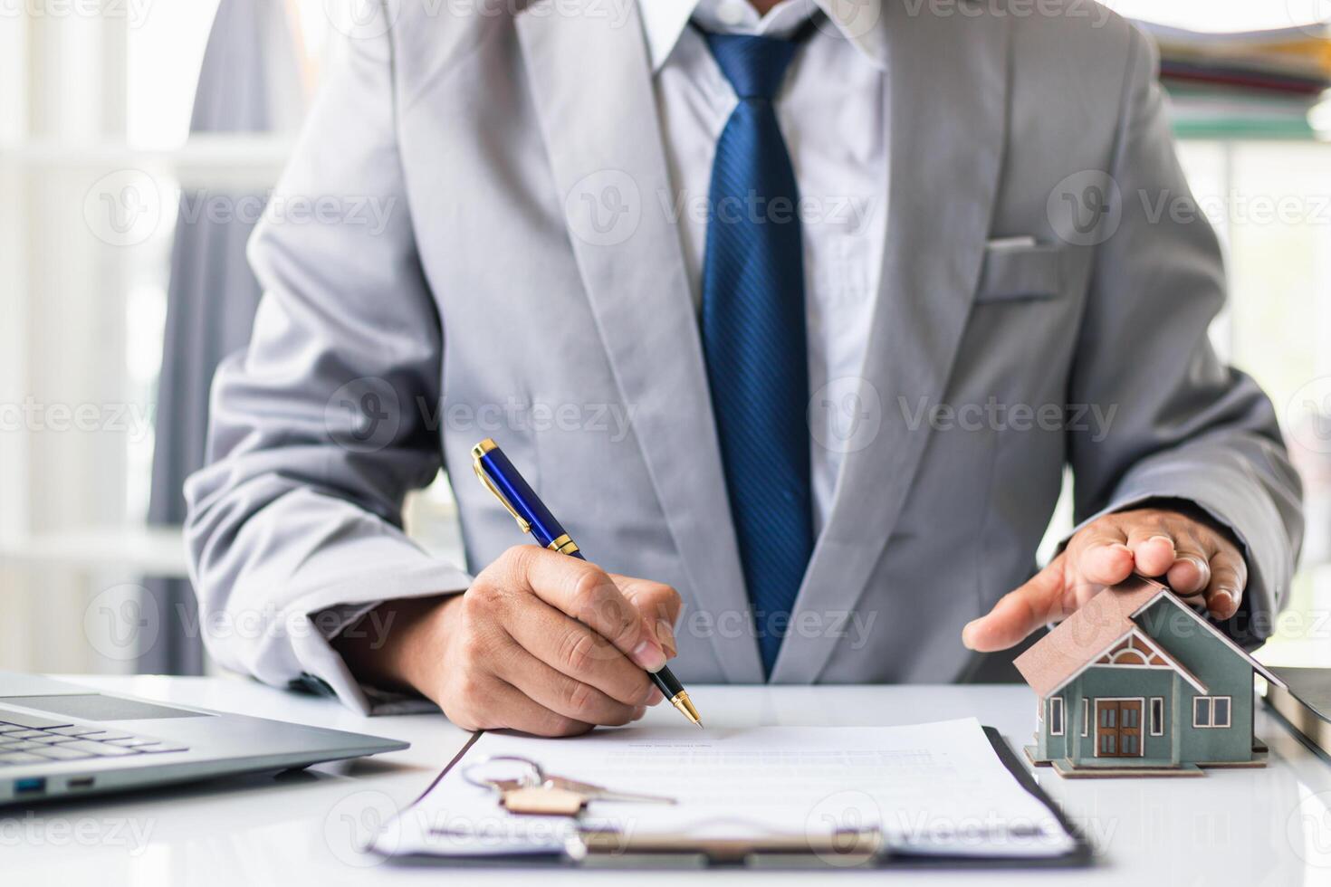 Real estate brokers are offering sample homes for customers choose from and recommending estate insurance promotions help protect their properties. Concept of offering real estate and home insurance photo