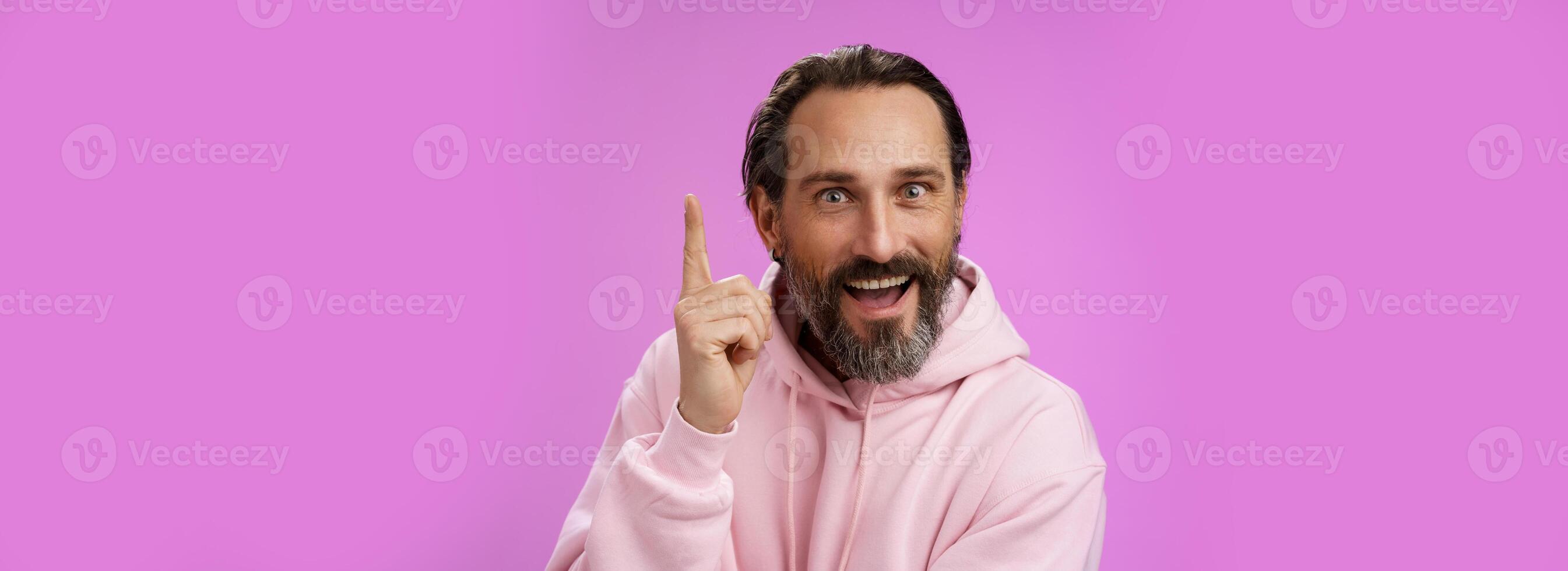 Have great idea listen. Excited energized happy charismatic male bearded guy raising index fingers add suggestion show eureka gesture smiling broadly suggesting perfect plan, purple background photo