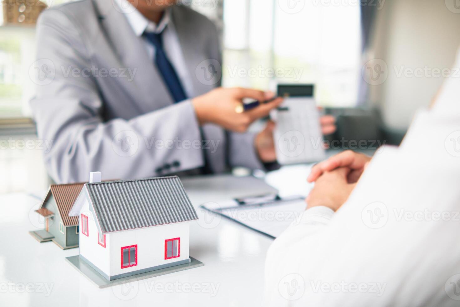 Real estate brokers are offering sample homes for customers choose from and recommending estate insurance promotions help protect their properties. Concept of offering real estate and home insurance photo