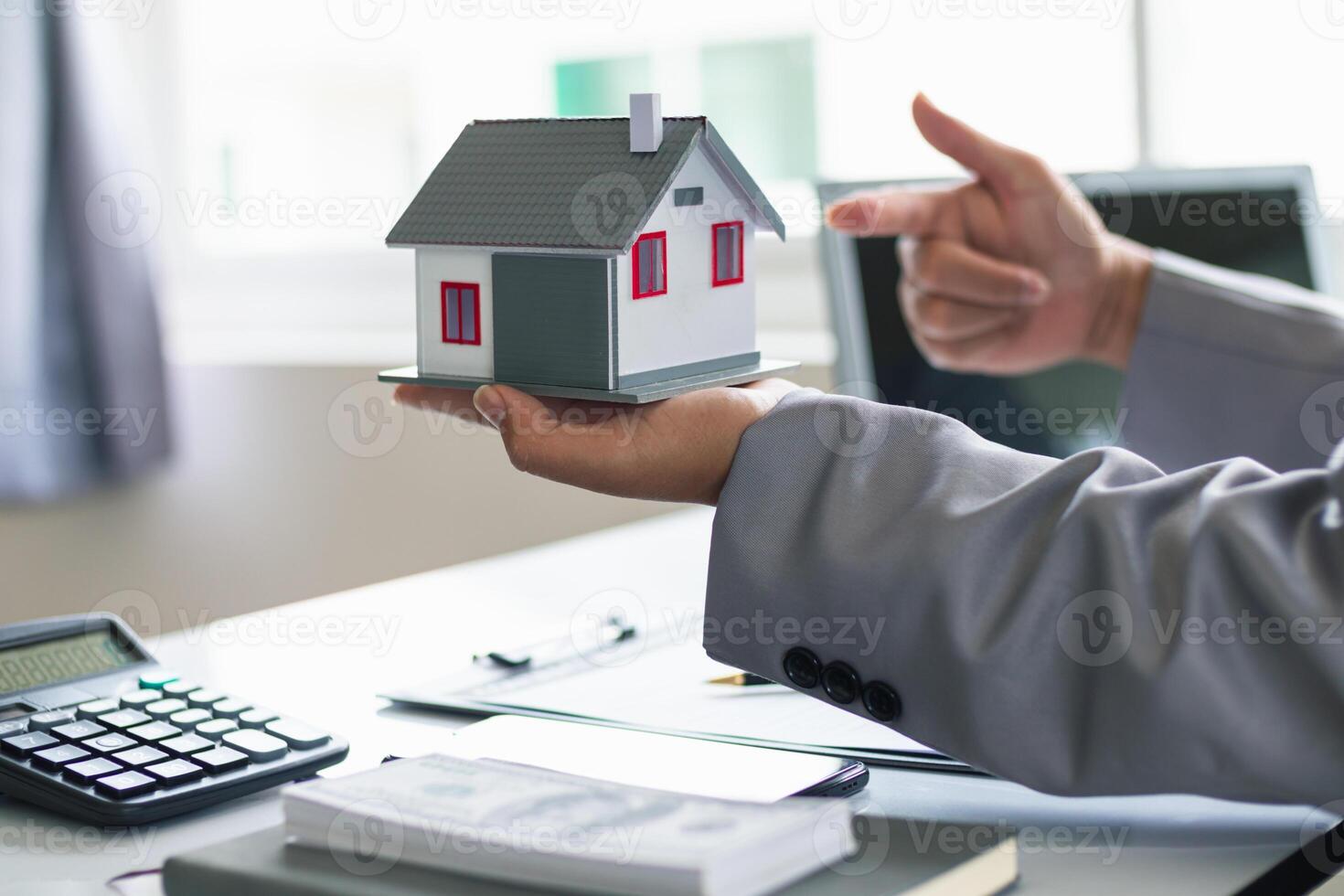 Real estate brokers are offering sample homes for customers choose from and recommending estate insurance promotions help protect their properties. Concept of offering real estate and home insurance photo