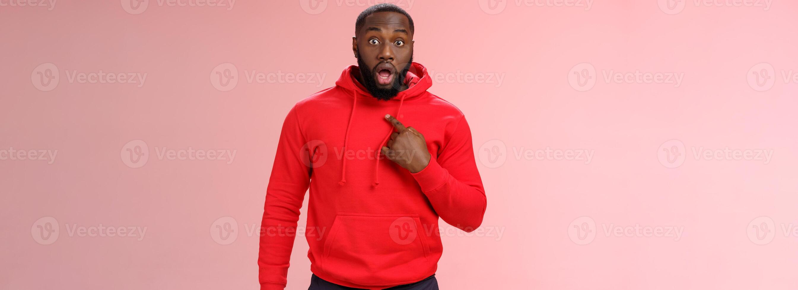 Shocked guy cannot believe he chosen drop jaw widen eyes staring camera speechless pointing himself impressed cannot believe picked do important task, standing stunned pink background photo